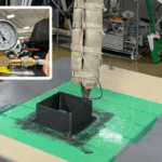 Vacuum-Assisted Extrusion 3D Printing nozzle extruding a dense composite polymer cube under vacuum to minimize internal voids